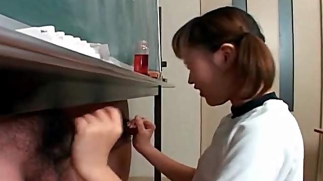 Schoolgirl strokes two dicks in classroom