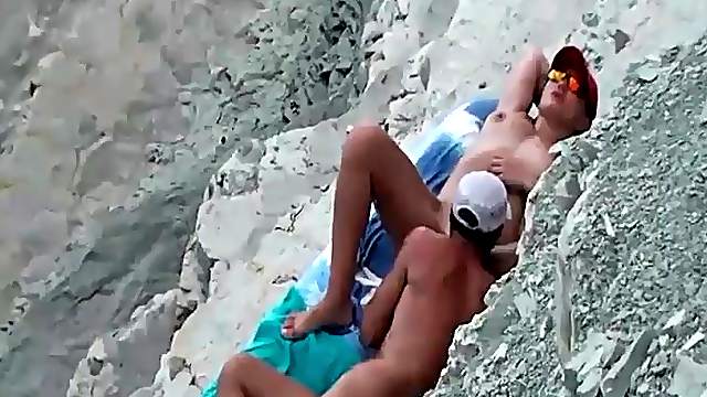 Husband eats out his wife on the beach