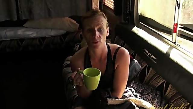 Mature blonde finishes her tea and gets naked