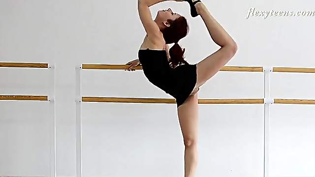 Redheaded ballerina in a little black dress