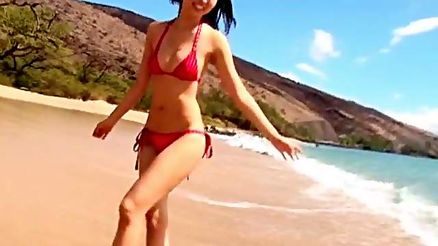 Slow motion Japanese ass in a bikini on the beach