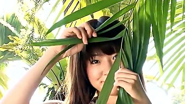 Slender Asian with sexy small tits teases solo outdoors