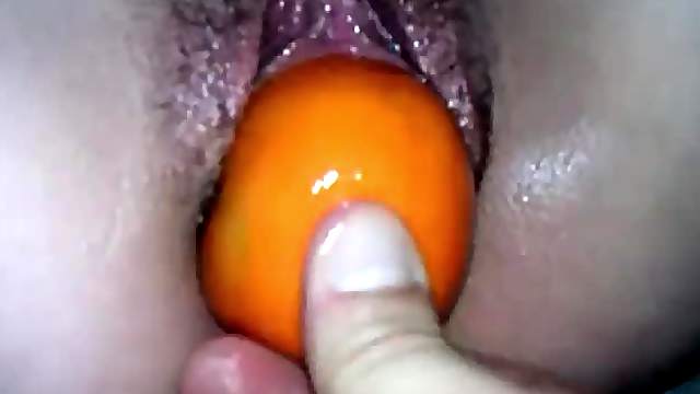 Putting fruit into her super wet pussy