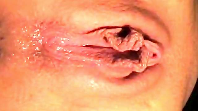 Extreme close up on a dripping solo pussy