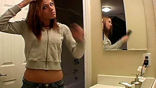 Watch teen beauty do her hair and makeup