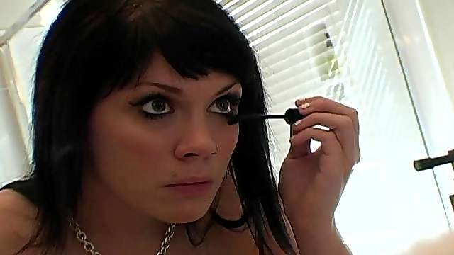 Bathroom camera shows her putting on makeup