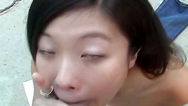 Asian babe give a hot outdoor blowjob